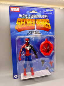 Marvel Legends Series Secret Wars Spider-Man (Alien Costume) action figure in its original blue blister card packaging, featuring the Spider-Man figure, red alien chest piece, and alternate hands.