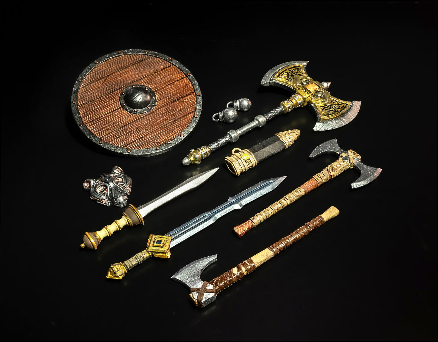 Collection of decorative axes and swords on a dark background