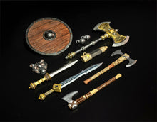 Collection of decorative axes and swords on a dark background
